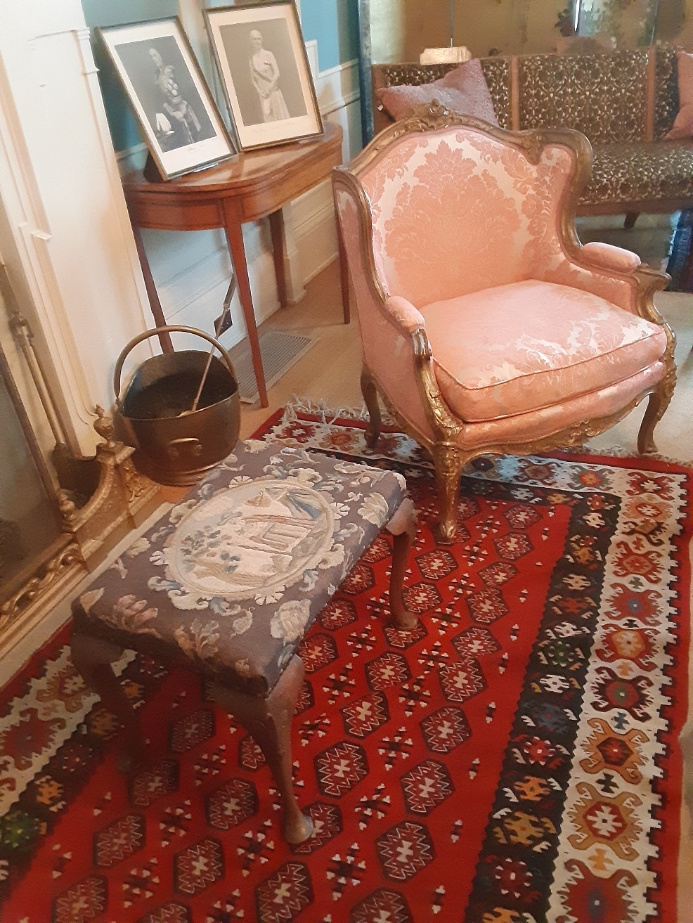 Upholstered furniture in a historic house showing fading from prior light exposure.